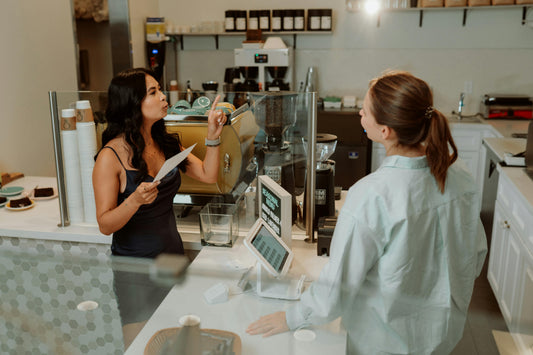 Customer ordering a drink from a barista at a cafe. Photo by the RDNE Stock Project.
