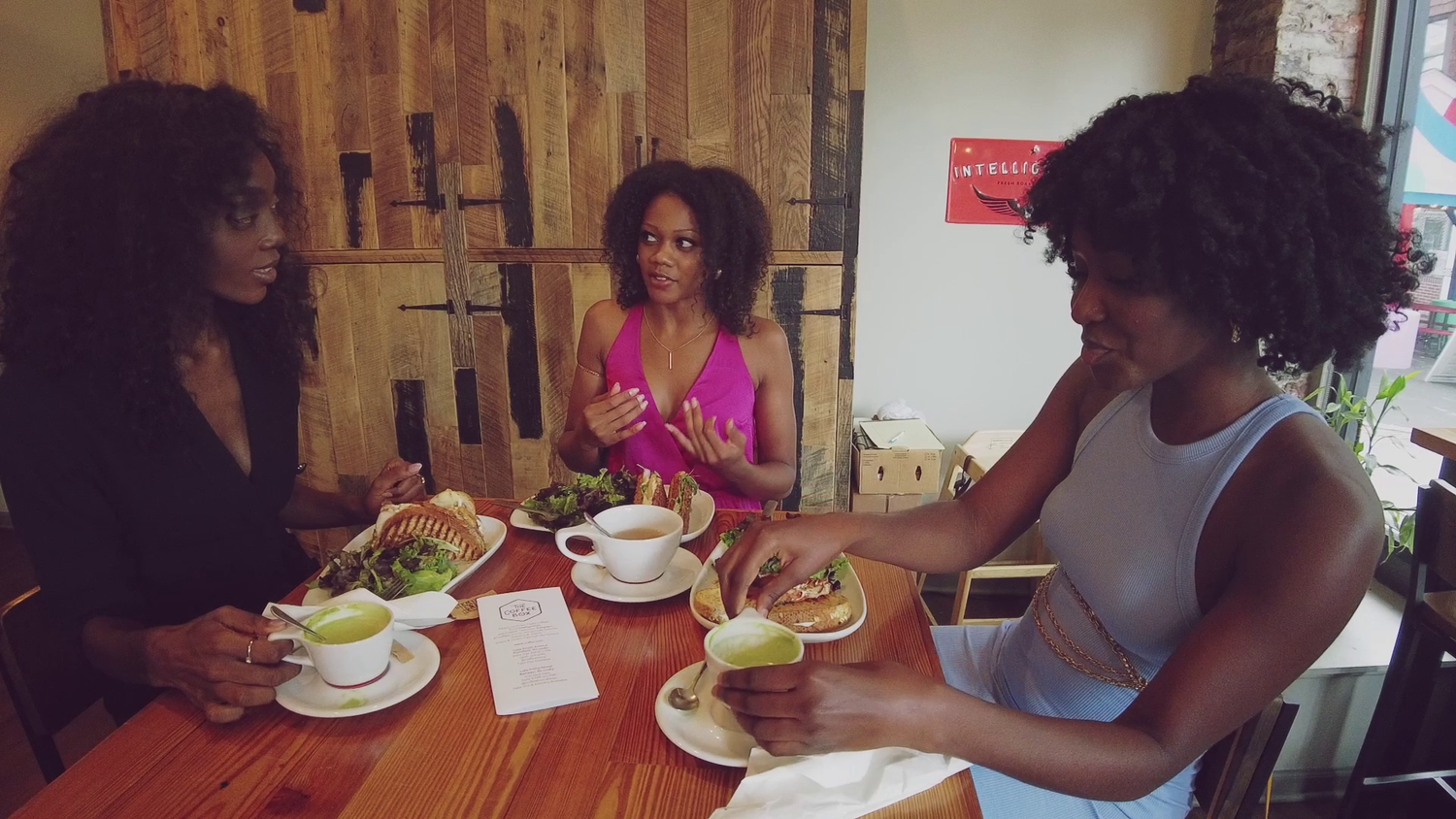 Three women eating brunch at a table
